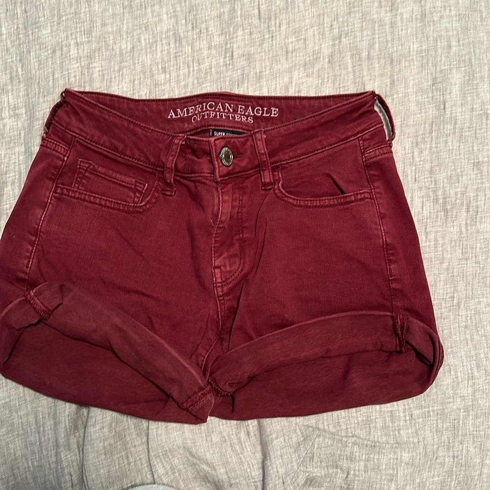 American Eagle maroon super stretch jean shorts size 4